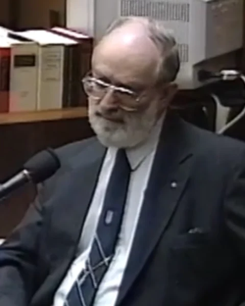 Courtroom still of Prof. Herbert MacDonell.