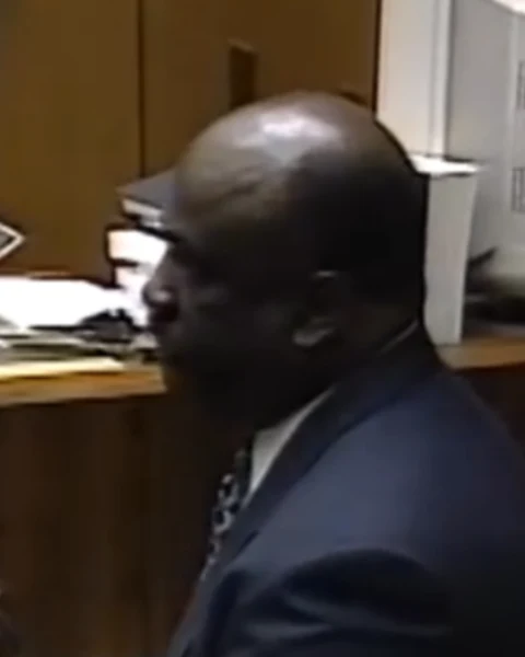 Courtroom still of Det. James Harper.