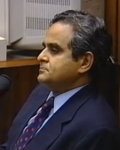 Courtroom still of Dr. Lakshmanan Sathyavagiswaran.