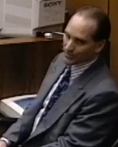 Courtroom still of Det. Mike Farrell.