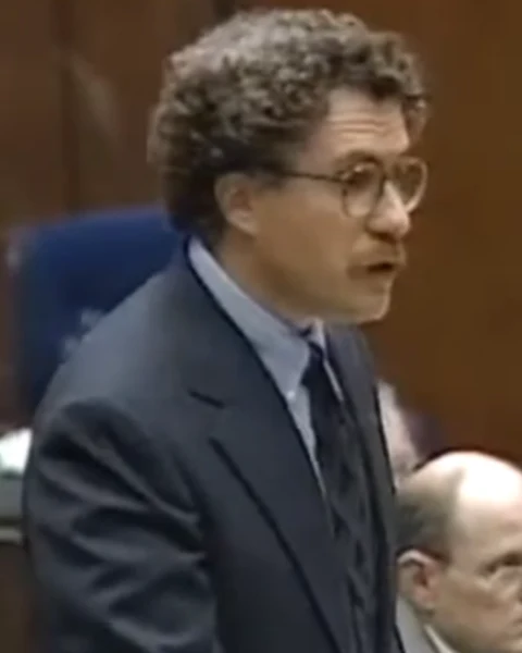 Courtroom still of Peter Neufeld.