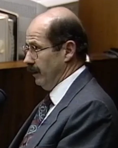 Courtroom still of Det. Tom Lange.