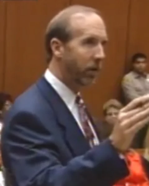 Courtroom still of William Hodgman.